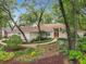 Beautiful home with mature trees and lush landscaping at 1869 Eagles Rest Dr, Apopka, FL 32712
