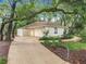 Charming home with mature trees and well-manicured landscaping at 1869 Eagles Rest Dr, Apopka, FL 32712