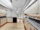 Well-lit kitchen boasts granite countertops, wood floors, and stainless steel appliances at 1869 Eagles Rest Dr, Apopka, FL 32712