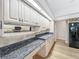Kitchen featuring granite countertops, wood floors, and under cabinet lighting at 1869 Eagles Rest Dr, Apopka, FL 32712
