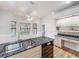 Bright kitchen with granite counters, wood floors, and bay window breakfast nook at 1869 Eagles Rest Dr, Apopka, FL 32712