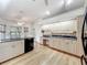 Bright kitchen with granite countertops, wood floors, and a spacious design at 1869 Eagles Rest Dr, Apopka, FL 32712