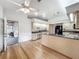 Bright kitchen with hardwood floors, granite countertops, and modern appliances at 1869 Eagles Rest Dr, Apopka, FL 32712