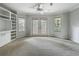 Bright living room with built-in shelving and french doors, perfect for entertaining at 1869 Eagles Rest Dr, Apopka, FL 32712