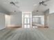 Bright and spacious living room featuring wood flooring, carpet, and a stylish entryway at 1869 Eagles Rest Dr, Apopka, FL 32712