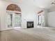 Spacious living room with fireplace and double doors leading to outdoor spaces at 1869 Eagles Rest Dr, Apopka, FL 32712
