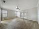 Living room with neutral carpet and large glass doors that provides ample natural light at 1869 Eagles Rest Dr, Apopka, FL 32712