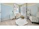 Adorable Bedroom with a neutral palette, complemented by animal-themed wall art, plush accents, and a cozy chair at 203 Taylor Groves Dr, Lake Wales, FL 33853