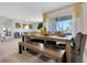 Inviting dining space with a large table, bench seating, and elegant decor, perfect for gatherings at 203 Taylor Groves Dr, Lake Wales, FL 33853