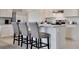 Kitchen with stainless steel appliances, a central island with bar seating, and abundant cabinet space at 203 Taylor Groves Dr, Lake Wales, FL 33853