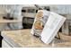 Close-up on modern countertop with cookbook, highlighting the kitchen's functional design and stylish touches at 203 Taylor Groves Dr, Lake Wales, FL 33853