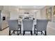 Stylish kitchen featuring barstool seating, stainless steel appliances, ample counter space and sleek cabinetry at 203 Taylor Groves Dr, Lake Wales, FL 33853