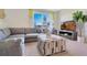 Stylish living room features bright window and plush seating arrangements at 203 Taylor Groves Dr, Lake Wales, FL 33853