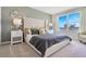 Serene main bedroom with a tufted headboard, bright window, and calming decor at 203 Taylor Groves Dr, Lake Wales, FL 33853