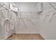 Walk-in closet with carpet, white walls, wire shelving, hangers and shopping bags at 203 Taylor Groves Dr, Lake Wales, FL 33853