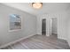 Neutral bedroom with new hardwood floors, closet, and updated lighting at 2105 9Th Ne St, Winter Haven, FL 33880