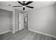 Bedroom showcasing gray walls, gray wood-look floors and a closet for storage at 2105 9Th Ne St, Winter Haven, FL 33880