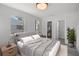 Bedroom featuring a bright window, with ensuite bathroom and walk-in closet at 2105 9Th Ne St, Winter Haven, FL 33880