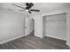 Bedroom featuring gray walls, wood-look flooring, and a closet for organization at 2105 9Th Ne St, Winter Haven, FL 33880