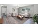 Living room featuring hardwood floors, natural light, and contemporary furniture at 2105 9Th Ne St, Winter Haven, FL 33880