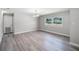 Bright living area featuring hardwood floors, modern lighting, and large windows at 2105 9Th Ne St, Winter Haven, FL 33880