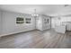 Spacious living area with hardwood floors, modern lighting, and large windows at 2105 9Th Ne St, Winter Haven, FL 33880