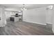 Open-concept living area with new hardwood floors and modern lighting at 2105 9Th Ne St, Winter Haven, FL 33880