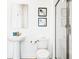 Modern bathroom featuring a glass shower, pedestal sink, and contemporary decor at 2916 Simile St, Kissimmee, FL 34746