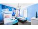 Bright bedroom featuring Frozen-themed decor, twin beds, and a unique lighting fixture at 2916 Simile St, Kissimmee, FL 34746