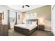 This bedroom features a king-sized bed, a ceiling fan, and side tables with lamps at 2916 Simile St, Kissimmee, FL 34746