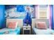 Charming bedroom featuring twin beds with Frozen-themed decor and a spacious layout at 2916 Simile St, Kissimmee, FL 34746