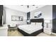 This bedroom features a king-sized bed, a desk, and soft, natural lighting at 2916 Simile St, Kissimmee, FL 34746