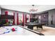 This game room features an air hockey table, pool table, two bunk beds and themed decor at 2916 Simile St, Kissimmee, FL 34746