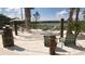 Relaxing hammock area with beach-like sand, lounge chairs, and views of the lake beyond at 2916 Simile St, Kissimmee, FL 34746