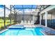 Heated pool with hot tub, patio furniture, and privacy screen at 2916 Simile St, Kissimmee, FL 34746