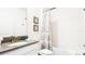 Bright bathroom featuring a shower-tub combo and a white vanity with a gray countertop at 2936 Protagonist St, Kissimmee, FL 34746