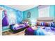 This themed bedroom features twin beds and an accent wall with Frozen decor at 2936 Protagonist St, Kissimmee, FL 34746