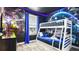 This themed bedroom features a bunk bed and an accent wall with Star Wars decor at 2936 Protagonist St, Kissimmee, FL 34746