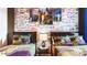 This themed bedroom features twin beds, stone accent wall and Harry Potter decor at 2936 Protagonist St, Kissimmee, FL 34746