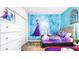 This themed bedroom features a twin bed and an accent wall with Frozen decor at 2936 Protagonist St, Kissimmee, FL 34746