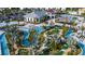 Resort-style pool area featuring a lazy river, miniature golf, and tropical landscaping at 2936 Protagonist St, Kissimmee, FL 34746