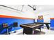 This game room features a pool table, foosball table, and comic book art at 2936 Protagonist St, Kissimmee, FL 34746