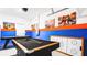 This game room features a pool table, foosball table, and comic book art at 2936 Protagonist St, Kissimmee, FL 34746