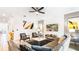 A living room decorated in grays and neutrals features modern decor and comfortable seating at 2936 Protagonist St, Kissimmee, FL 34746