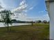 Beautiful lakefront view with community homes in the background at 3084 Ella Way, St Cloud, FL 34771