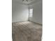 Bedroom showcasing neutral carpet and a window with blinds, creating a serene space at 3084 Ella Way, St Cloud, FL 34771