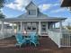 Exterior of clubhouse with seating area and chairs at 3084 Ella Way, St Cloud, FL 34771