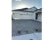 A spacious two-car garage and brick-paved driveway enhance this home's curb appeal at 3084 Ella Way, St Cloud, FL 34771