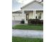 Charming home featuring a two-car garage, stone accents, and well-maintained landscaping at 3084 Ella Way, St Cloud, FL 34771