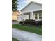 Charming home featuring a two-car garage, stone accents, and well-maintained landscaping at 3084 Ella Way, St Cloud, FL 34771